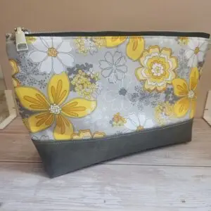 x-large pouch with black zipper and grey faux leather base