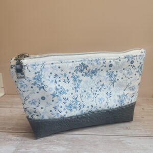 medium pouch with black zipper and grey faux leather base